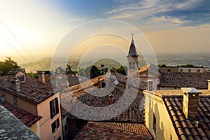 Sunset view of San Marino microstate and Emilia-Romagna region of Italy from the rooftops of the city of San Marino