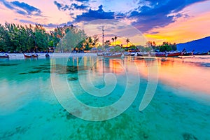 Beautiful sunset on white sand beach and Clear water to see the coral reef at Koh Lipe island in Satun,Thailand