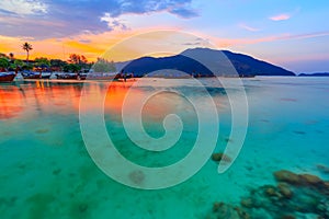 Beautiful sunset on white sand beach and Clear water to see the coral reef at Koh Lipe island in Satun,Thailand