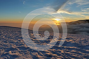 Beautiful sunset in winter mountain