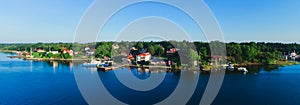 Beautiful super wide-angle aerial view of Stockholm archipelago skerries and suburbs with classic sweden scandinavian designed cot