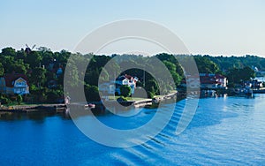 Beautiful super wide-angle aerial view of Stockholm archipelago skerries and suburbs with classic sweden scandinavian designed cot