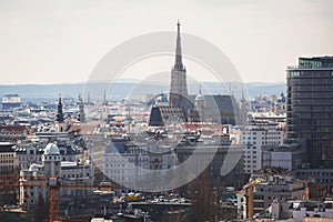 Beautiful super-wide angle aerial view of Vienna, Austria, with old town Historic Center and scenery beyond the city, shot from fe