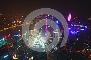 Beautiful super wide-angle night aerial view of Shanghai, China with Pudong district, TV tower, the Bund and scenery beyond the ci