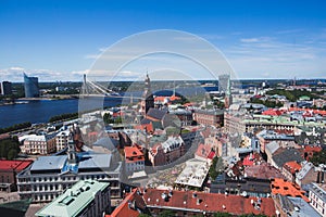Beautiful super wide-angle panoramic aerial view of Riga, Latvia with harbor and skyline with scenery beyond the city