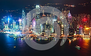 Beautiful super wide-angle summer aerial view of Hong Kong island skyline, Victoria Bay harbor, with skyscrapers, blue sky