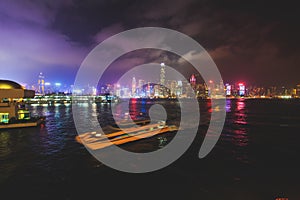 Beautiful super wide-angle summer aerial view of Hong Kong island skyline, Victoria Bay harbor, with skyscrapers, blue sky