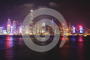 Beautiful super wide-angle summer aerial view of Hong Kong island skyline, Victoria Bay harbor, with skyscrapers, blue sky