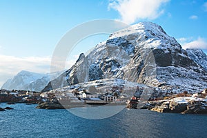 Beautiful super wide-angle winter snowy view of fishing village A, Norway, Lofoten Islands, with skyline, mountains, famous fishin