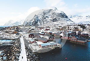 Beautiful super wide-angle winter snowy view of fishing village A, Norway, Lofoten Islands, with skyline, mountains, famous fishin