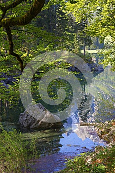 Beautiful Superior Fusine lake with Mangart mountain reflected in the water, Julian Alps, Italy, Europe. photo