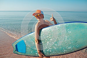 Beautiful surfer girl on the beach