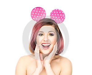 Beautiful surprised woman in Mickey mouse ears