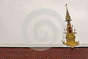 Beautiful swan sculptures on the church roof under the blue sky background at Wat Phra That Doi Prabat (Wat Doi Phra Baht) in