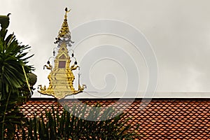 Beautiful swan sculptures on the church roof under the blue sky background at Wat Phra That Doi Prabat (Wat Doi Phra Baht) in