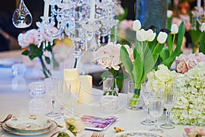 Beautiful table set with candles and flowers