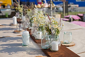 Beautiful table set with candles and flowers for a festive event, party or wedding reception