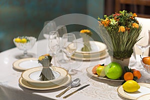 Beautiful table set with flowers for a festive event, party or wedding reception