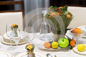 Beautiful table set with flowers for a festive event, party or wedding reception