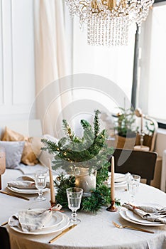 Beautiful table setting for Christmas dinner in Scandinavian style