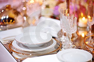 Beautiful table setting with crockery and flowers for a party, wedding reception or other festive event