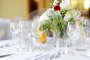 Beautiful table setting with crockery and flowers for a party, wedding reception or other festive event