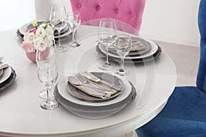 Beautiful table setting in dining room interior