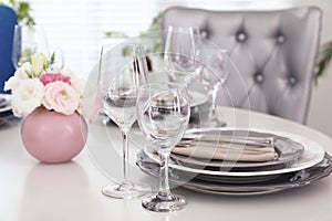 Beautiful table setting in dining room interior