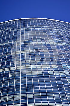 Beautiful tall glass building against the blue sky