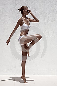 Beautiful tan female model posing