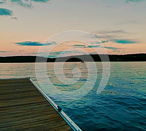 Beautiful Tangerine Sunset Over the Lake at the Dock