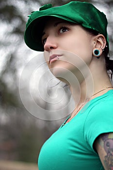 Beautiful tatooed woman, piercings photo