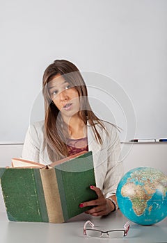 Beautiful teacher reading book