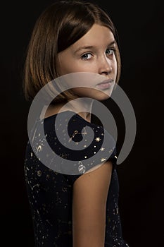 Beautiful teen girl, close-up, black background
