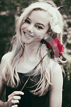 Beautiful teen girl with rose