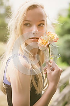 Beautiful teen girl with rose