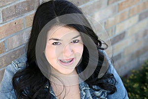 Beautiful teen hispanic girl with braces