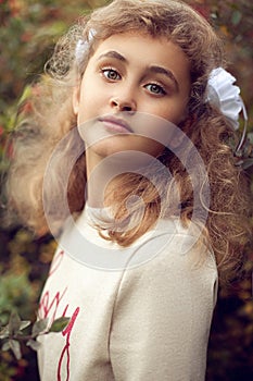 Beautiful teenage girl 10 years old, adorable face looking strai