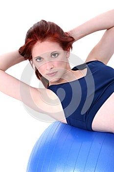 Beautiful Teenage Girl Demonstrating Situp On Exercise Ball