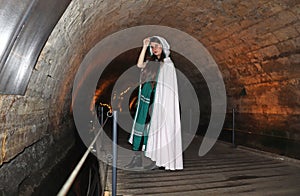A teenage girl in the Templars tunnel in Akko, Israel photo