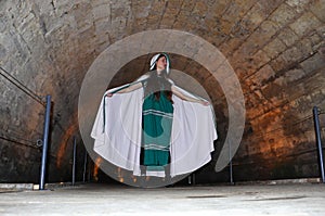 A teenage girl in the Templars tunnel in Akko, Israel photo