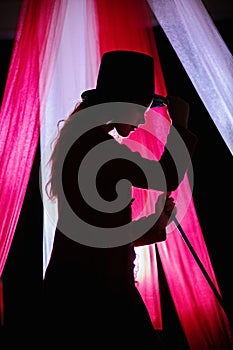 Beautiful Teenage Girl Dressed in Circus Ringmaster Costume, in Profile