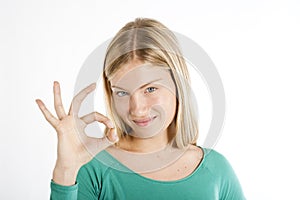 Beautiful teenage girl ok gesture