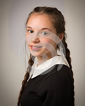 Beautiful Teenage Girl With Plaits Dressed In Black