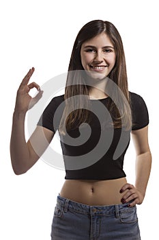 Beautiful teenage girl portrait gesturing ok sign