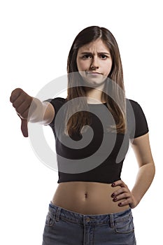 Beautiful teenage girl portrait gesturing thumbs down