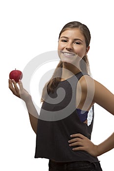 Beautiful teenage girl portrait holding one red apple