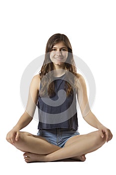 Beautiful teenage girl portrait sitting lotus position smiling