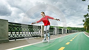 Beautiful teenage girl roller-skating