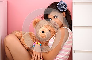 Beautiful teenage girl with teddy bear